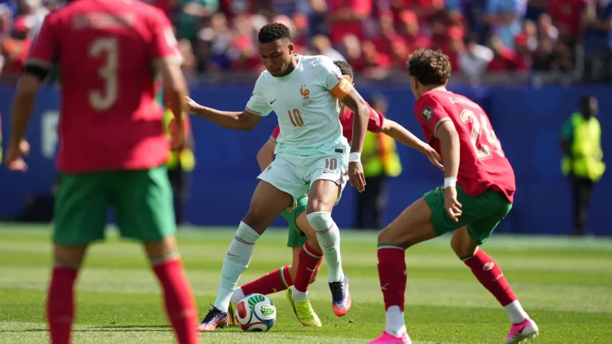 Player dribbling the ball during France vs Morocco match Player dribbling the ball during France vs Morocco match