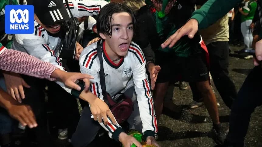 Fans celebrating in crowd during sporting event Fans celebrating in crowd during sporting event