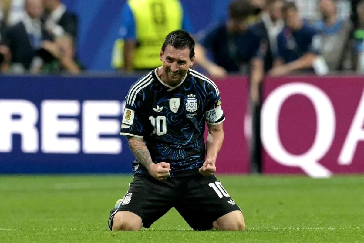 Lionel Messi celebrating on the pitch for Argentina Lionel Messi celebrating on the pitch for Argentina