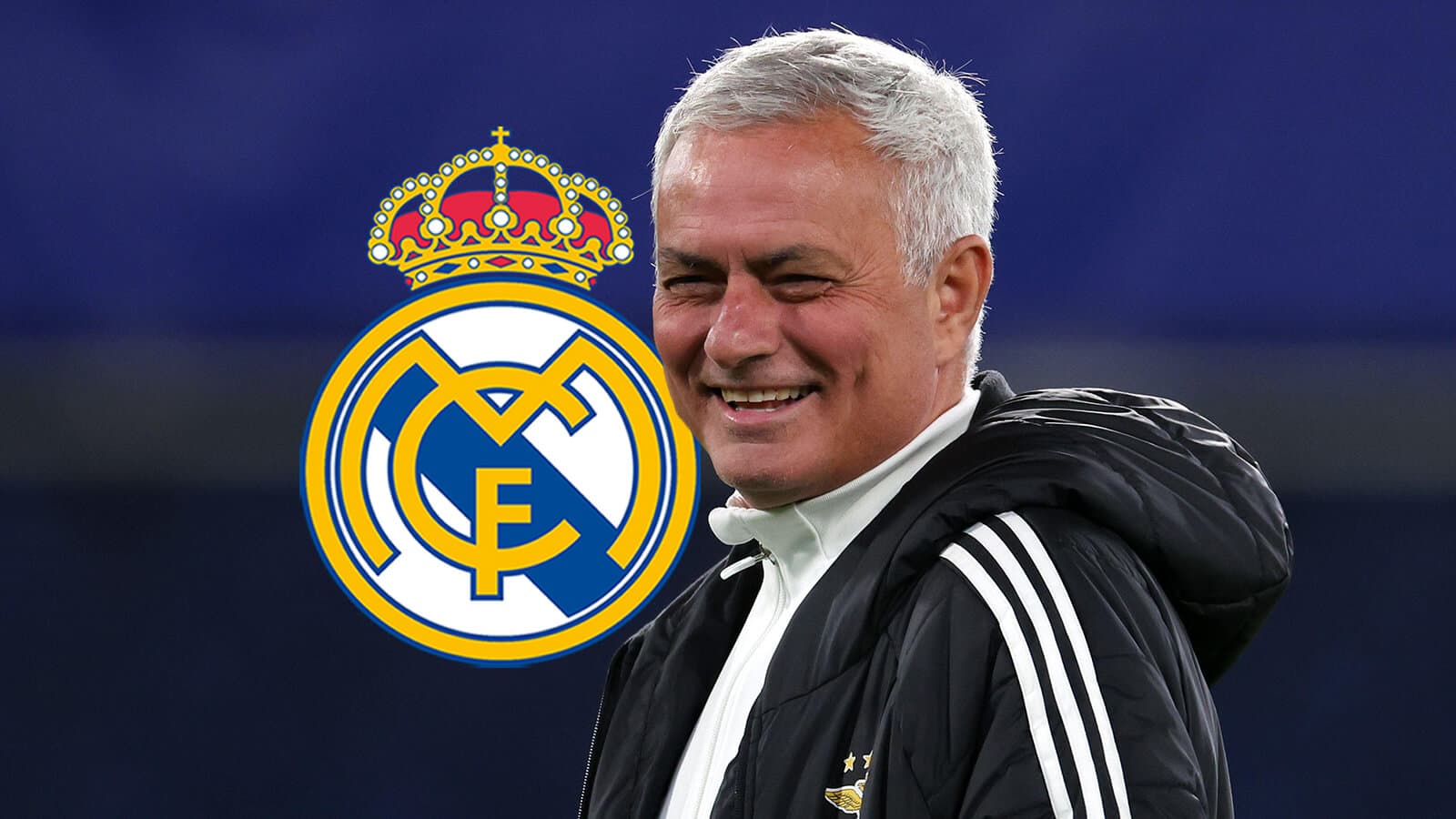 Coach smiling with Real Madrid logo in background Coach smiling with Real Madrid logo in background