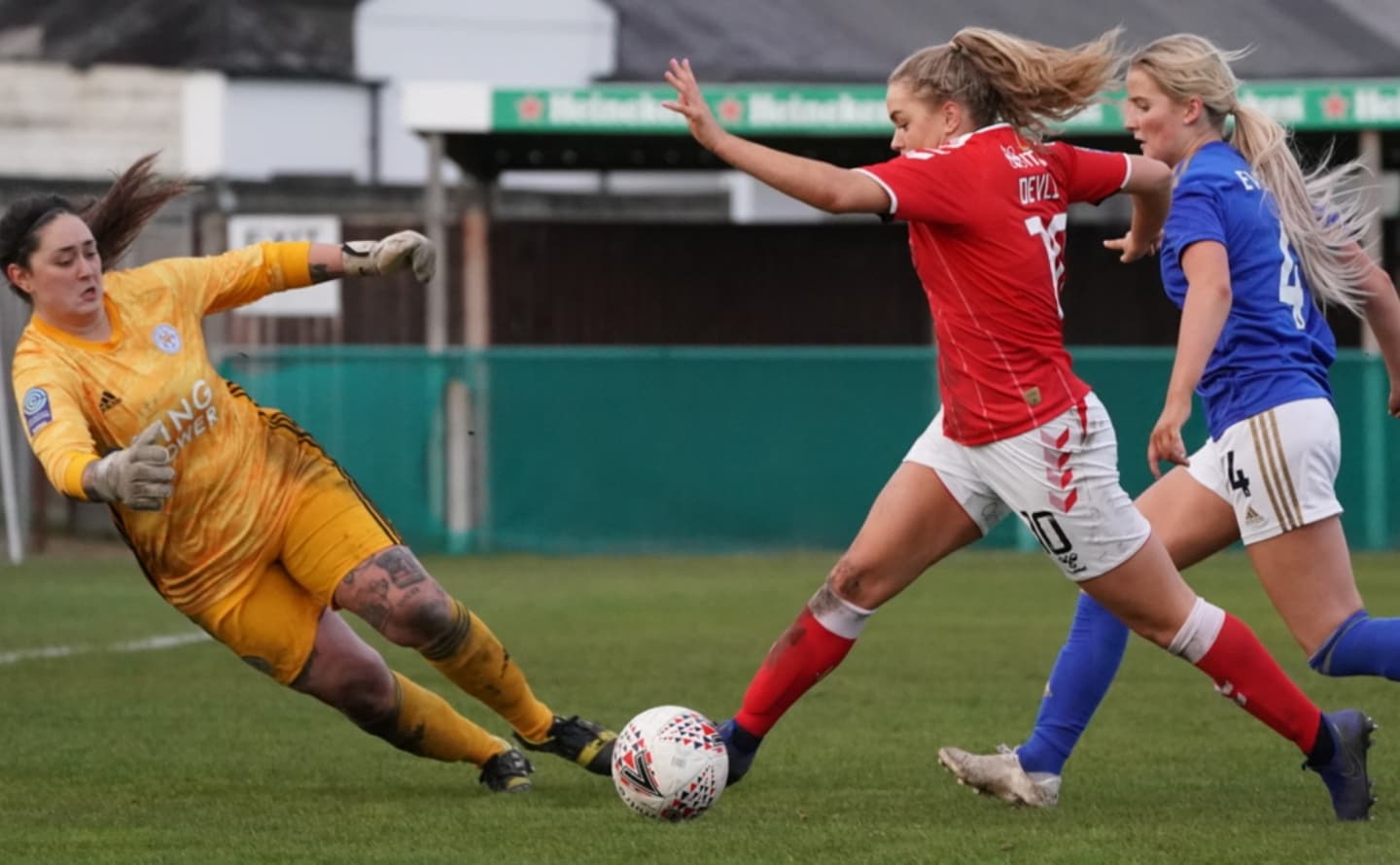 Charlton Athletic W player evading Leicester City WFC goalkeeper Charlton Athletic W player evading Leicester City WFC goalkeeper