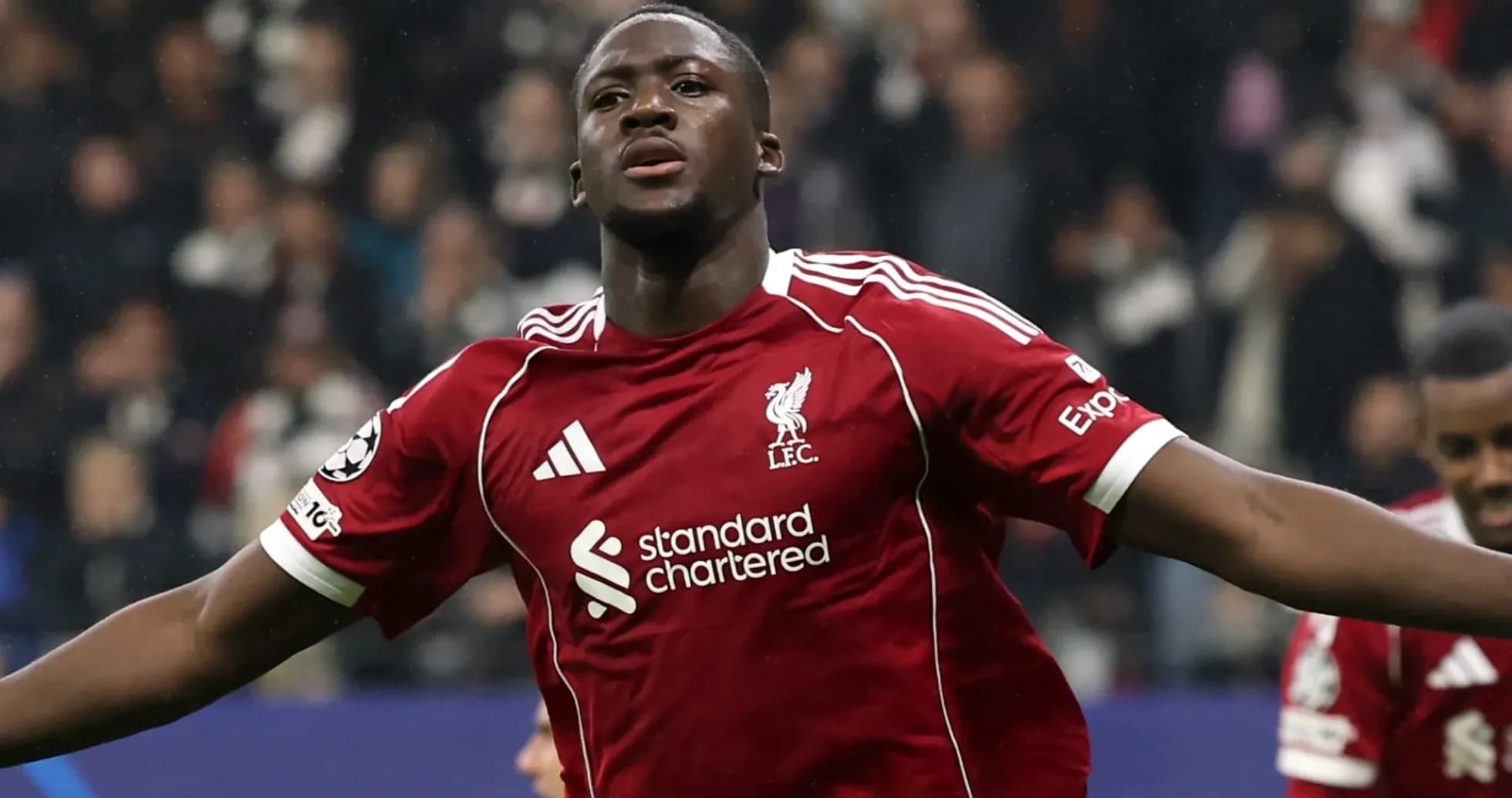 Player celebrating goal in Liverpool red kit Player celebrating goal in Liverpool red kit