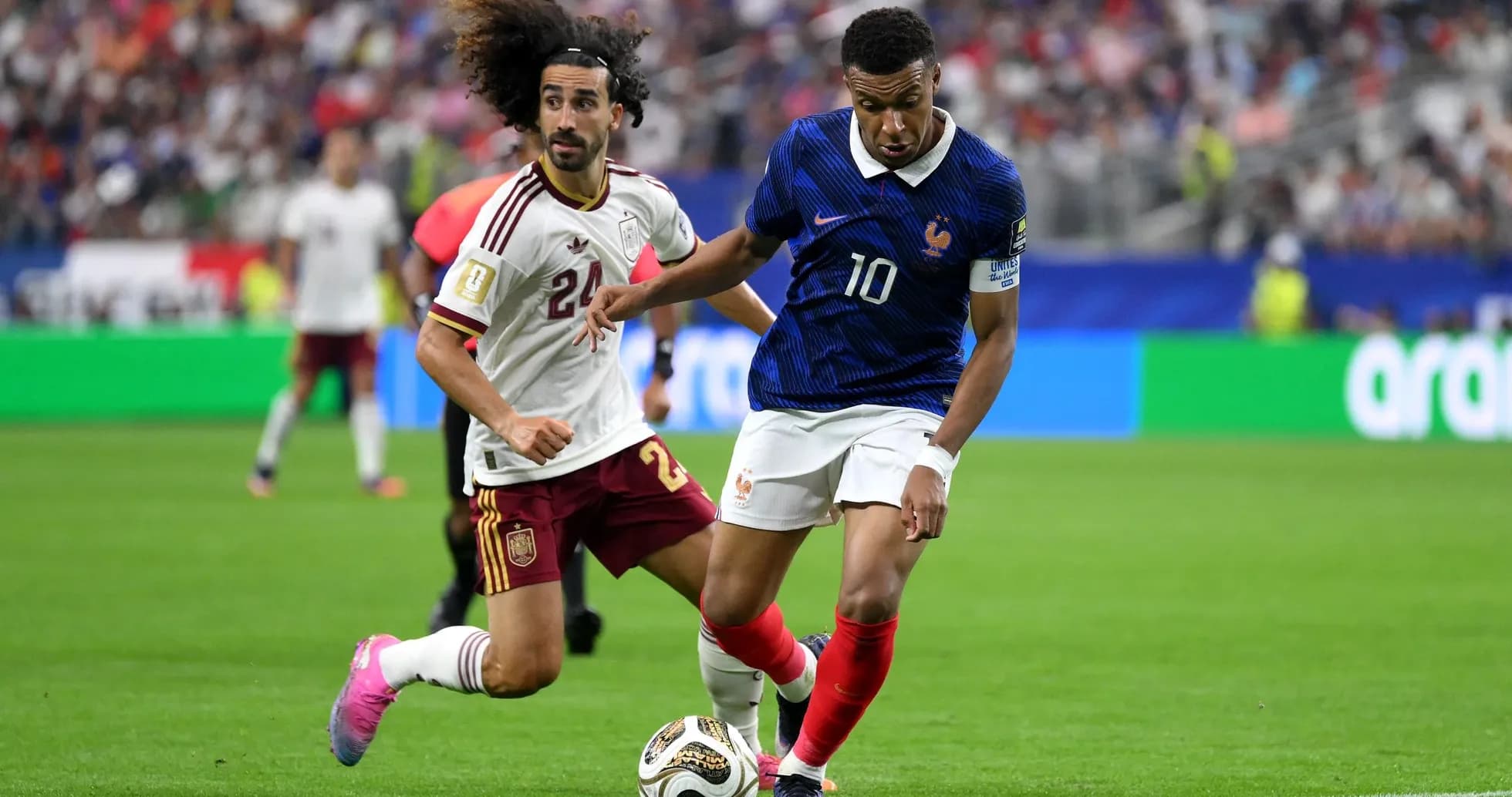 Kylian Mbappe dribbling against Spain player Kylian Mbappe dribbling against Spain player