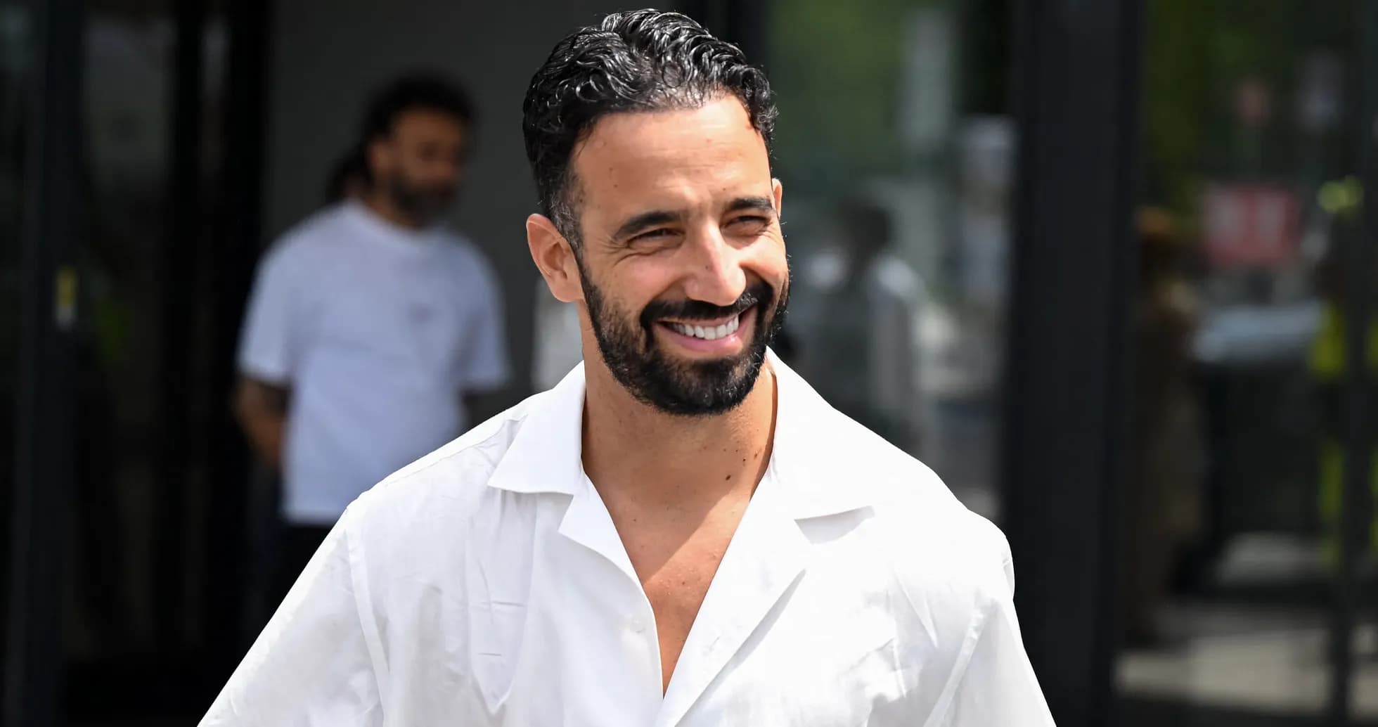 Smiling man in a white shirt outdoors Smiling man in a white shirt outdoors