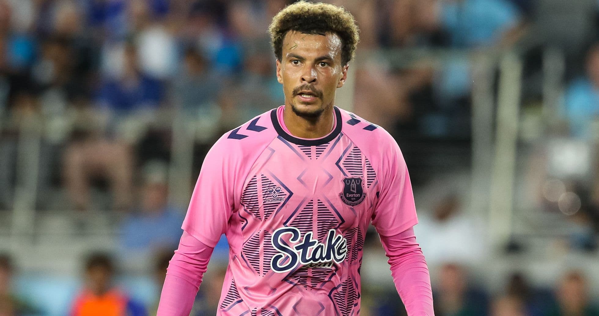 Goalkeeper in pink jersey during a match Goalkeeper in pink jersey during a match