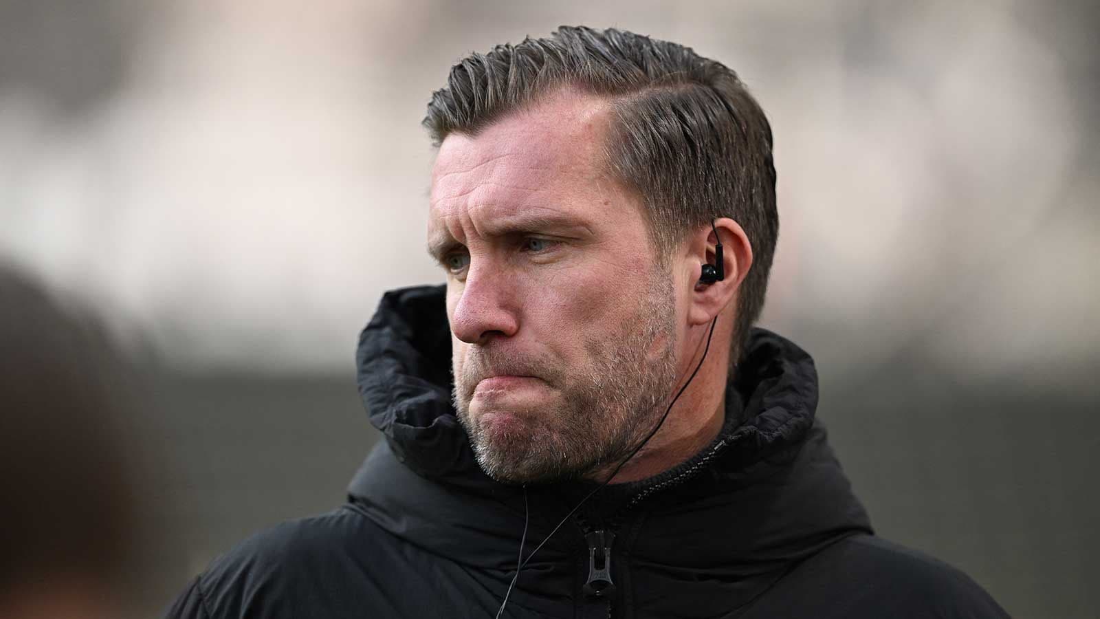 Coach wearing headphones during training session Coach wearing headphones during training session