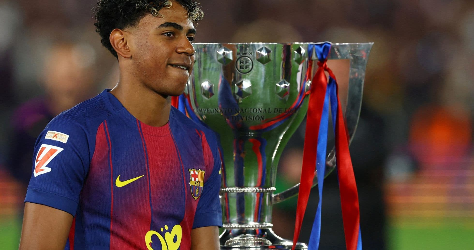 Player celebrating with trophy after match Player celebrating with trophy after match