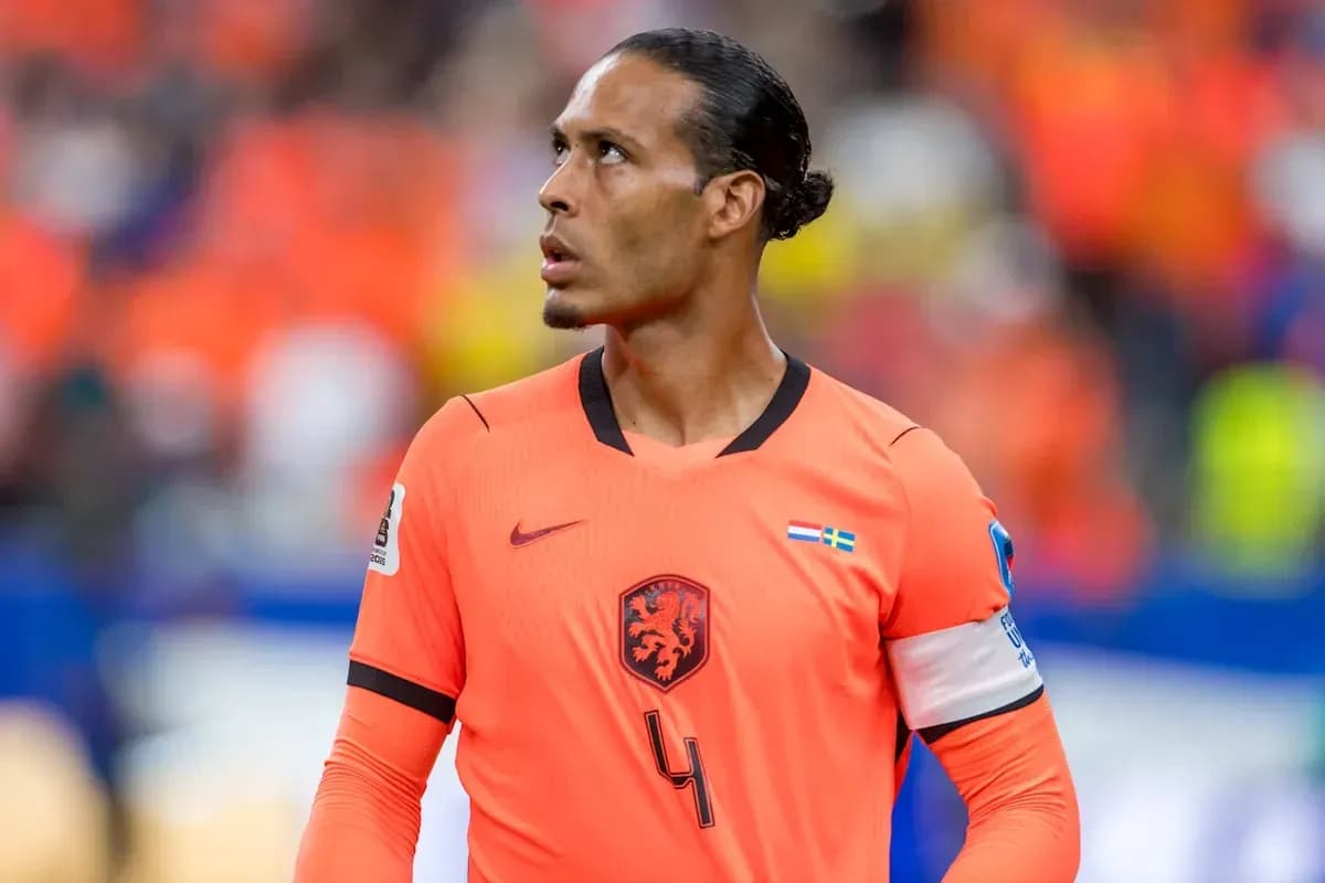 Player in orange jersey looking upwards during match Player in orange jersey looking upwards during match