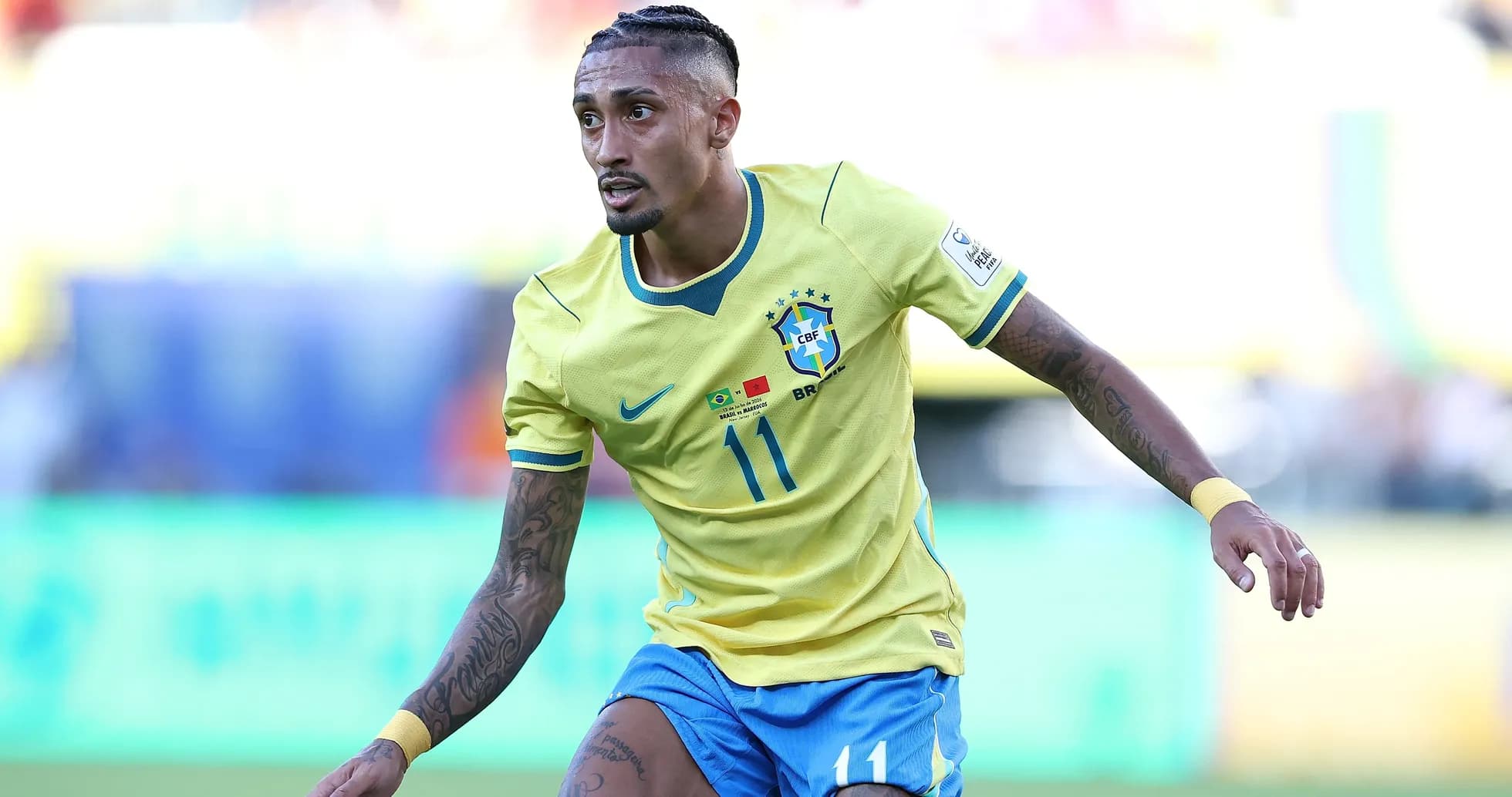 Brazilian player in yellow jersey running on field Brazilian player in yellow jersey running on field