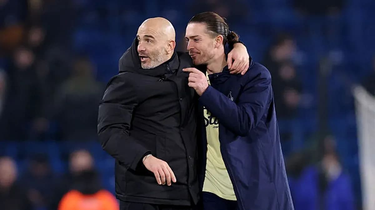 Coach and player celebrating after match conclusion Coach and player celebrating after match conclusion