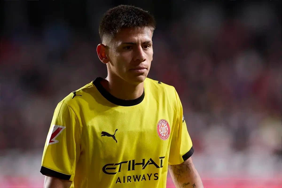 Player in yellow kit walking on the field Player in yellow kit walking on the field