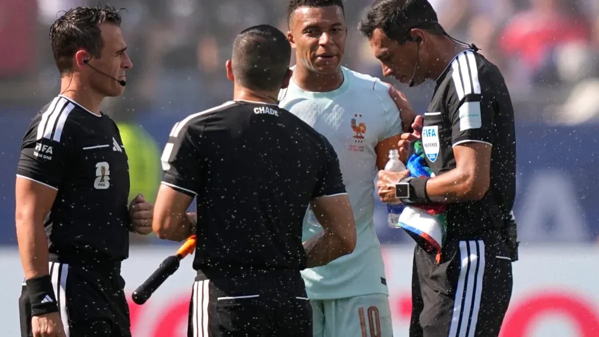 Kylian Mbappé talking to referees during match Kylian Mbappé talking to referees during match
