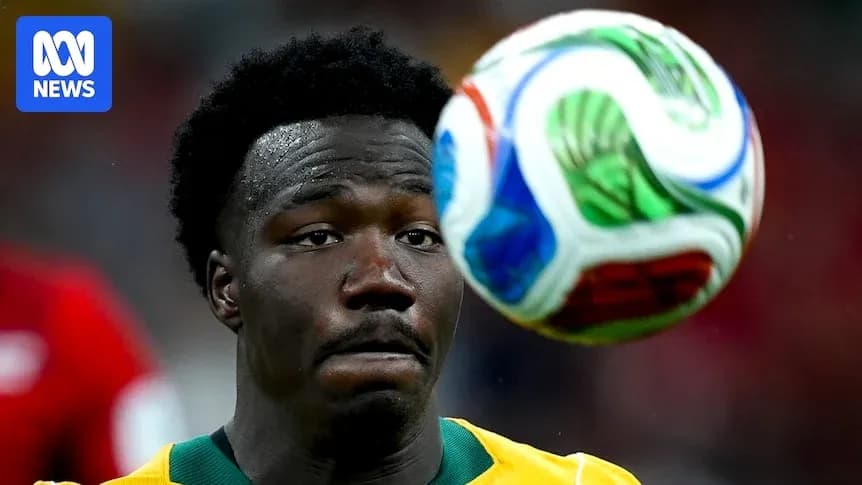 Player watching a soccer ball in mid-air Player watching a soccer ball in mid-air