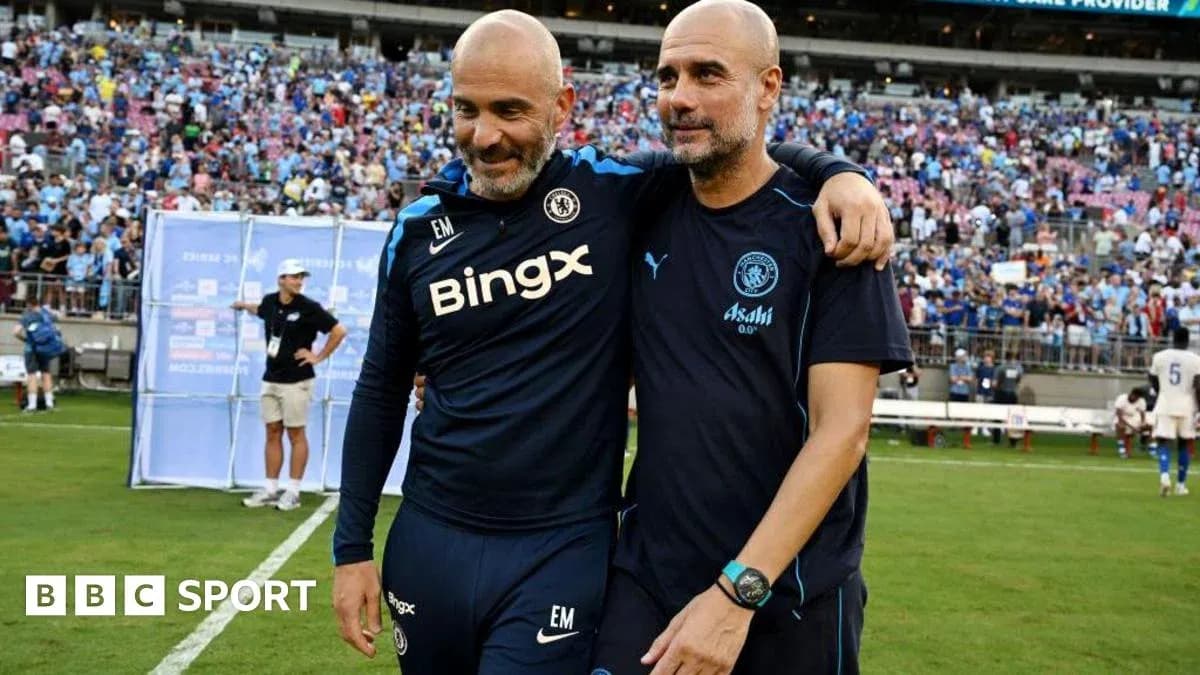 Two coaches embracing on the field after match Two coaches embracing on the field after match