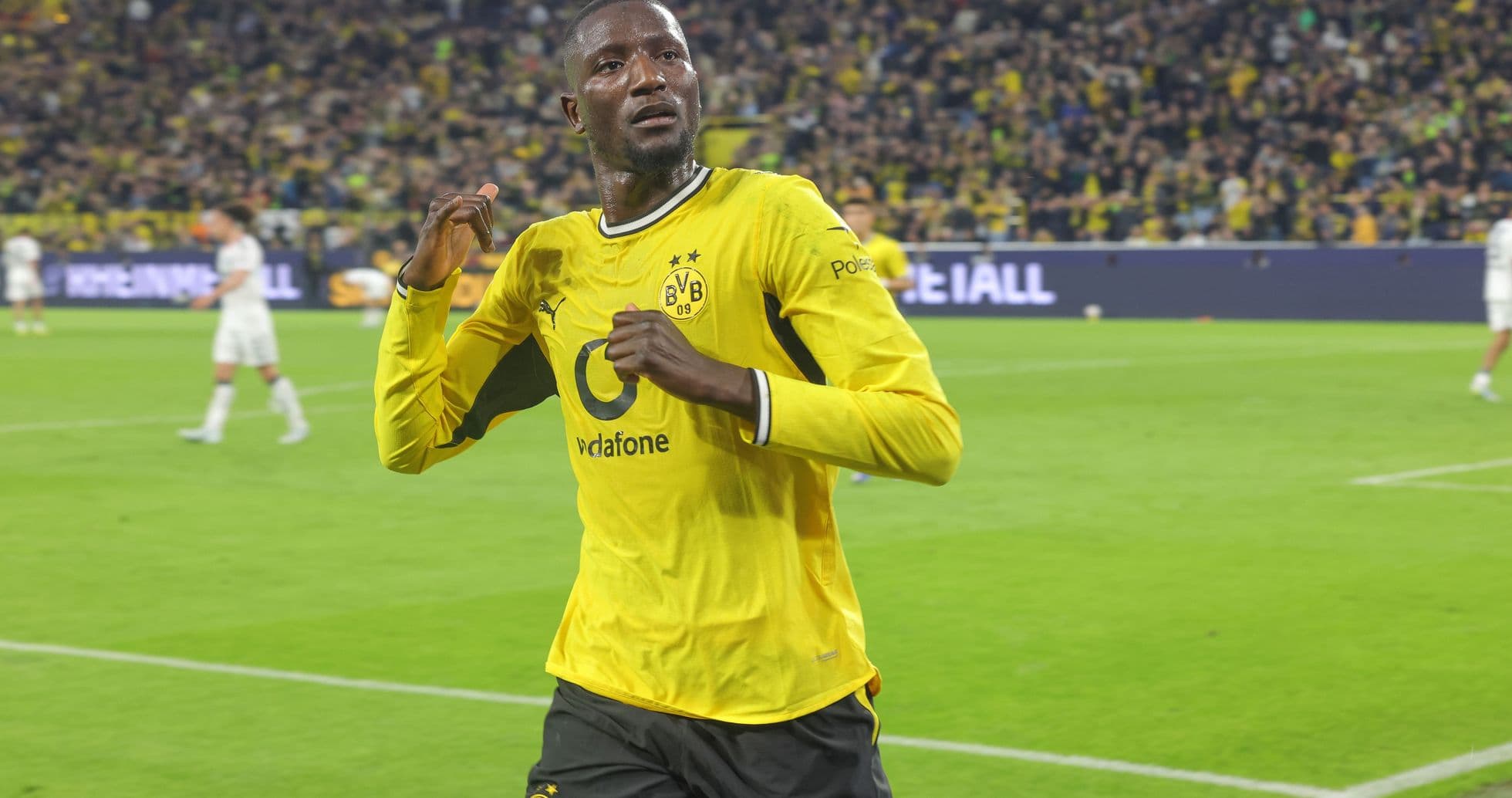 Player celebrating after scoring for Borussia Dortmund Player celebrating after scoring for Borussia Dortmund