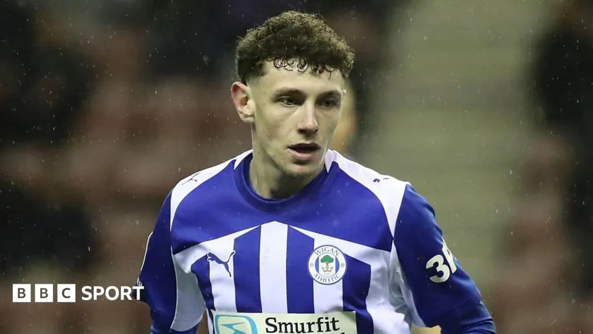 Wigan Athletic player during match action Wigan Athletic player during match action