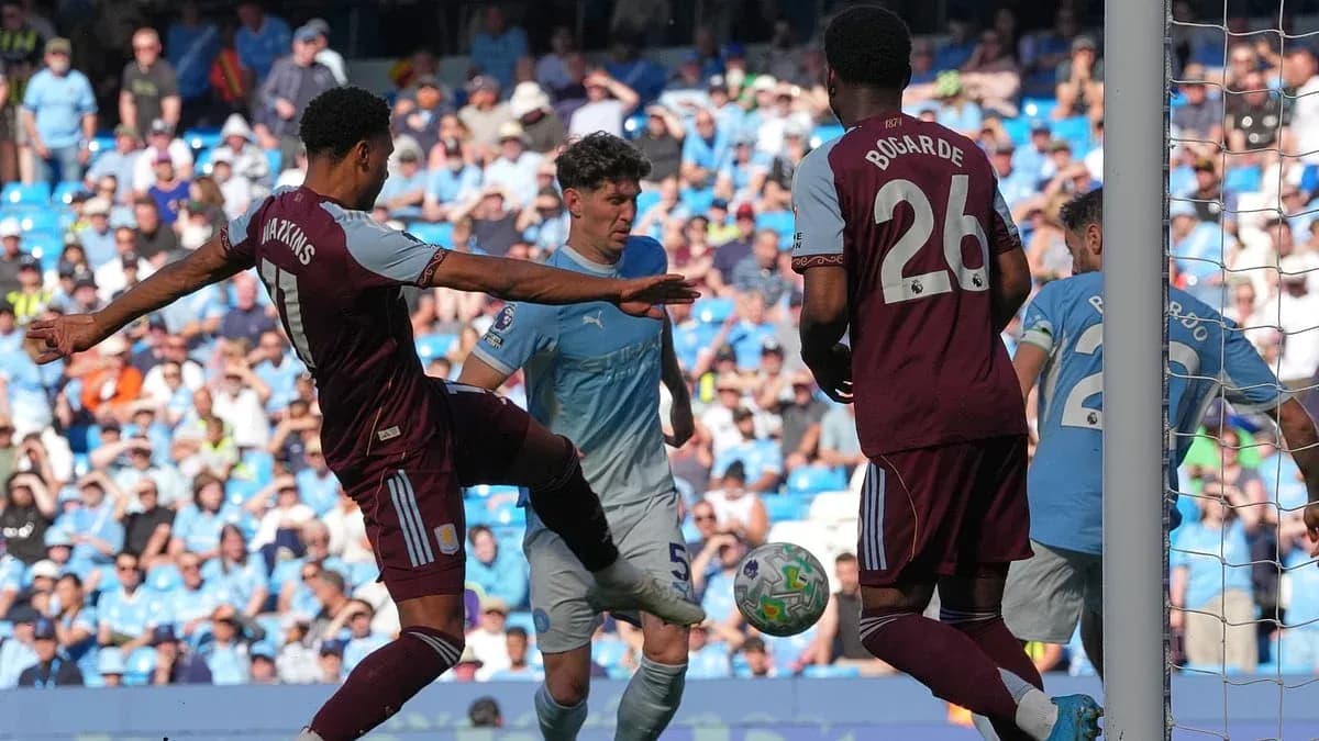 Watkins challenging for the ball in Premier League match Watkins challenging for the ball in Premier League match