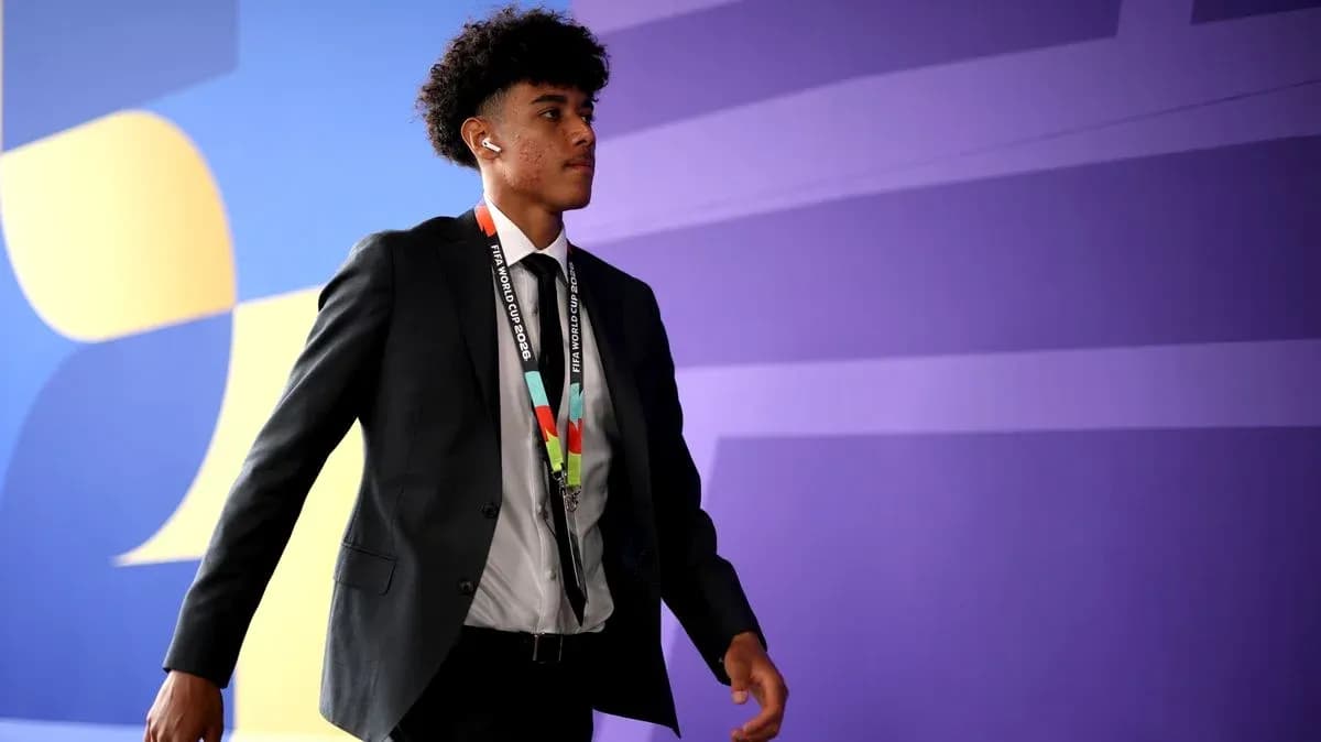 Player walking in formal attire with accreditation lanyard Player walking in formal attire with accreditation lanyard