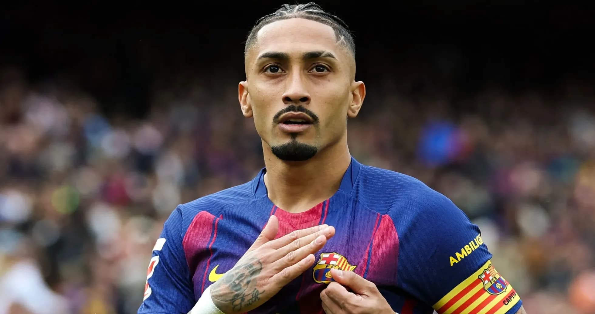 Player touching club badge on jersey during match Player touching club badge on jersey during match