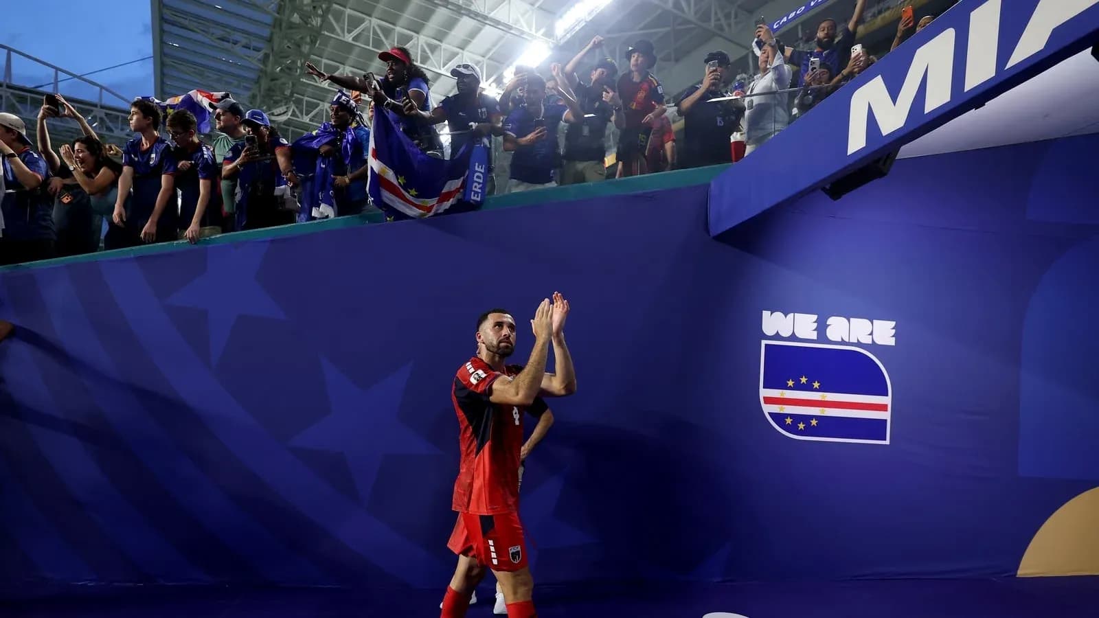 Player applauding fans after the match Player applauding fans after the match