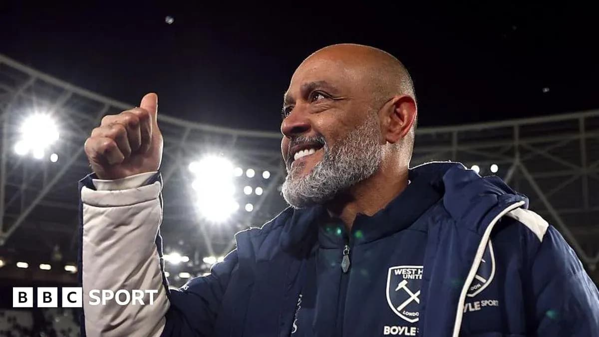 Coach celebrating with a thumbs up at stadium Coach celebrating with a thumbs up at stadium