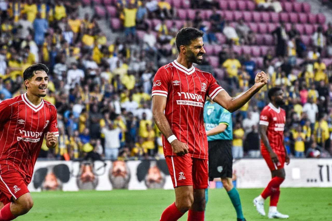 Hapoel Beer Sheva players celebrating goal Hapoel Beer Sheva players celebrating goal