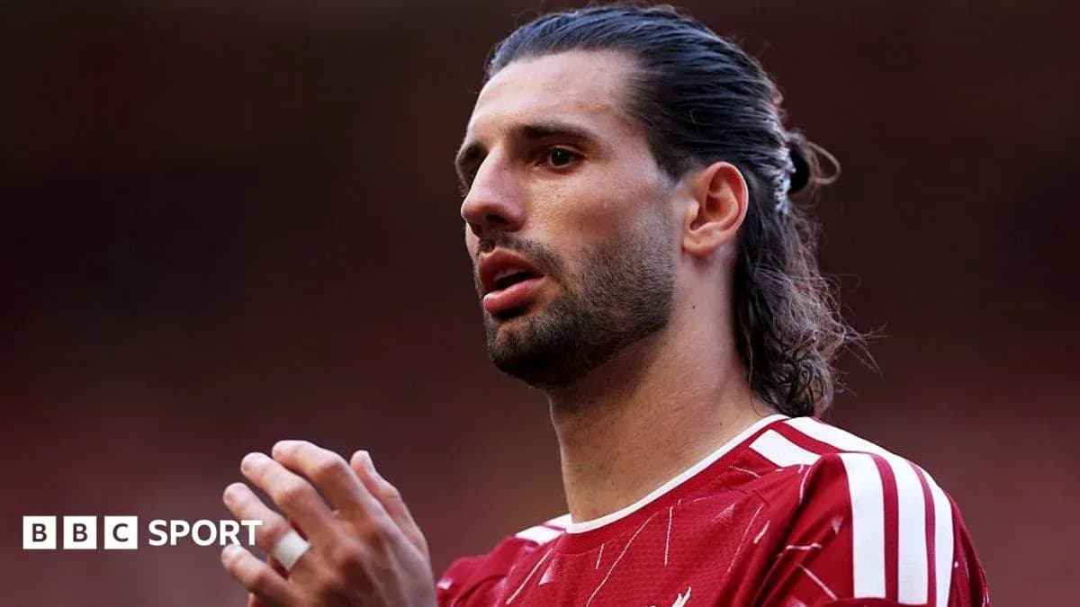 Player wearing red jersey during match preparation Player wearing red jersey during match preparation