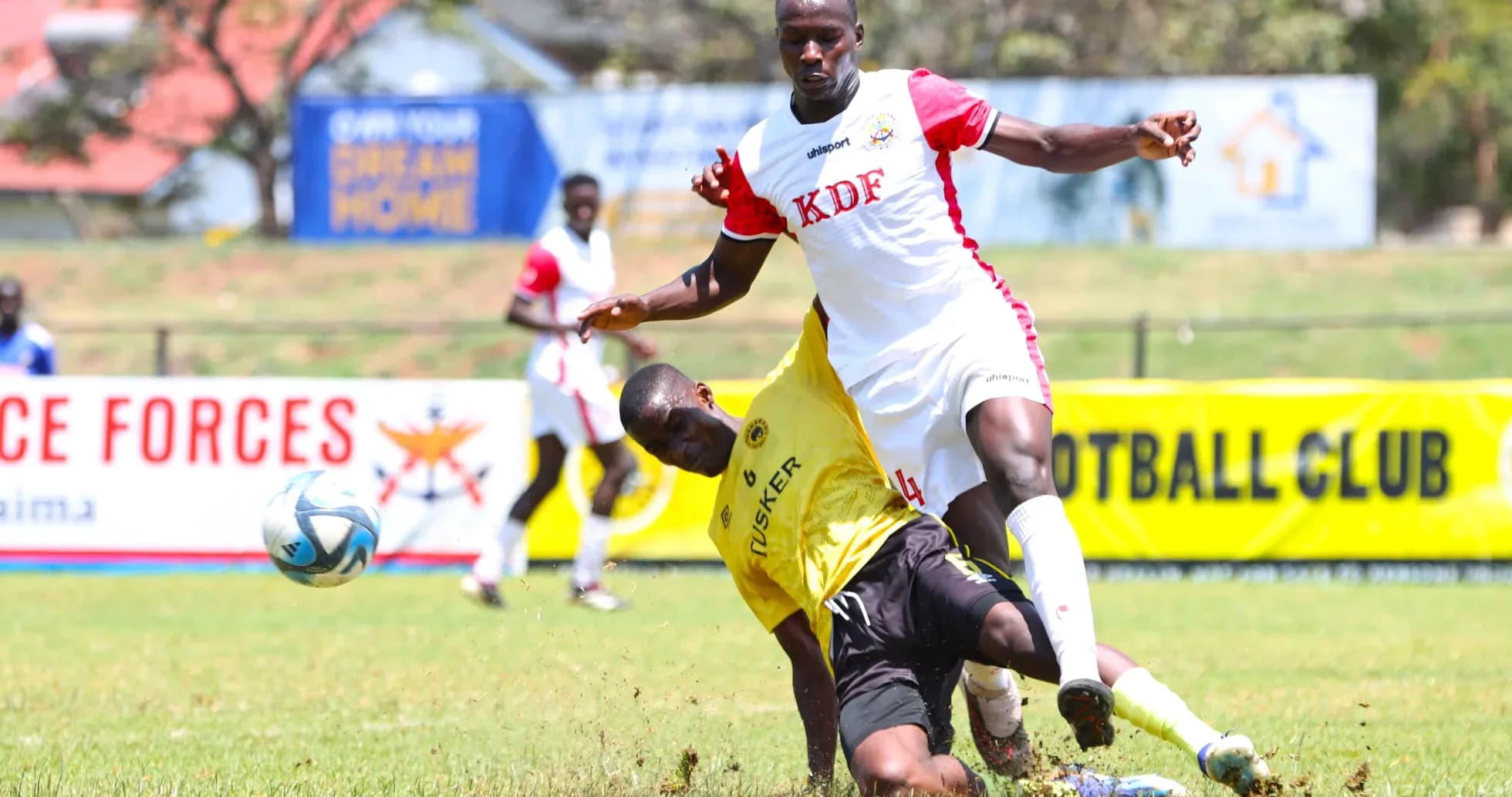 Ulinzi Stars player tackling Tusker opponent Ulinzi Stars player tackling Tusker opponent