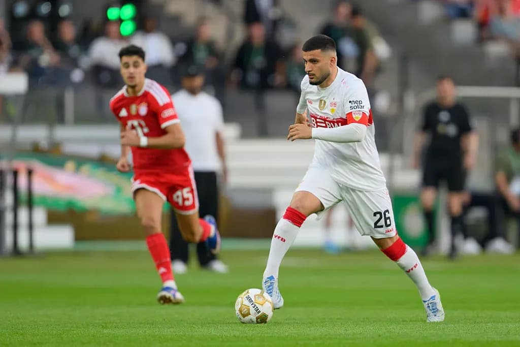 Player dribbling the ball during a match Player dribbling the ball during a match