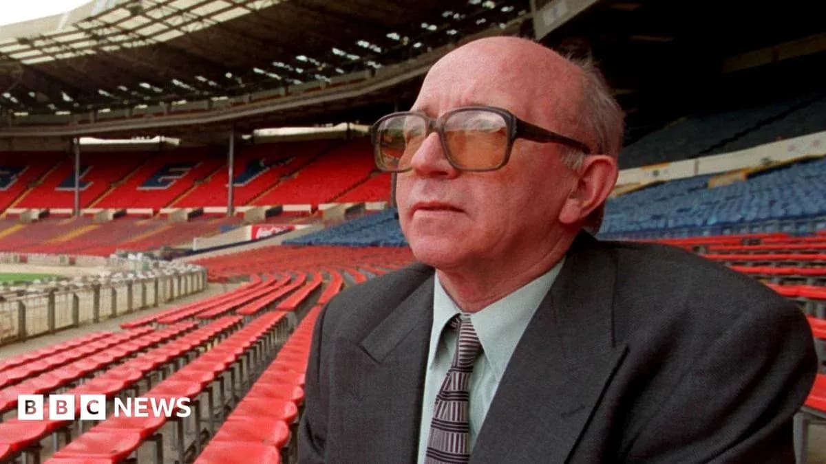 Man sitting in empty stadium seats, looking ahead Man sitting in empty stadium seats, looking ahead