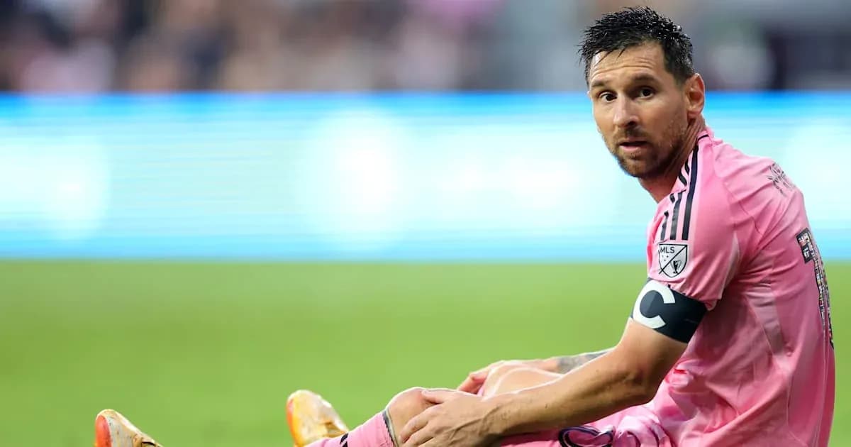 Player seated on field during match in pink jersey Player seated on field during match in pink jersey
