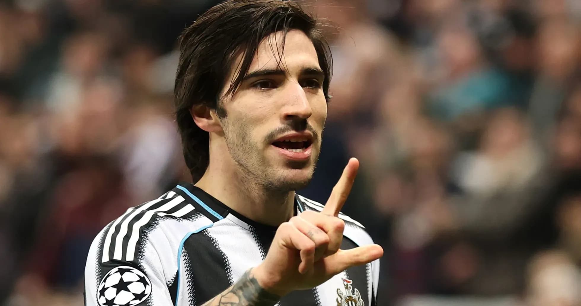 Player gesturing during a football match Player gesturing during a football match