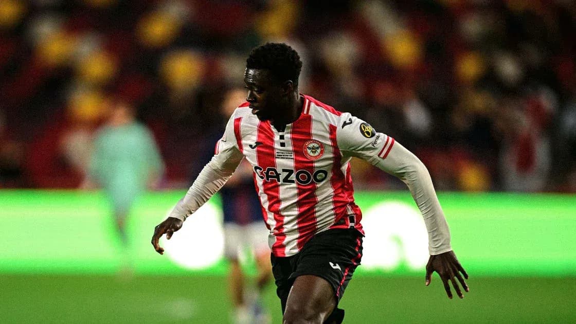 Brentford player sprinting on the pitch during match Brentford player sprinting on the pitch during match