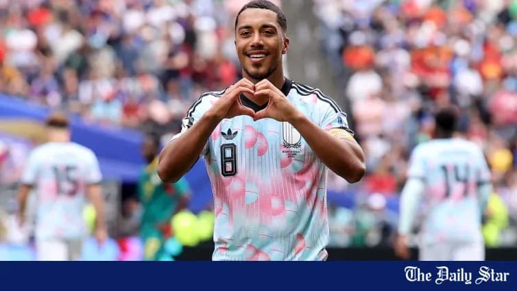 Player making heart gesture after scoring goal Player making heart gesture after scoring goal