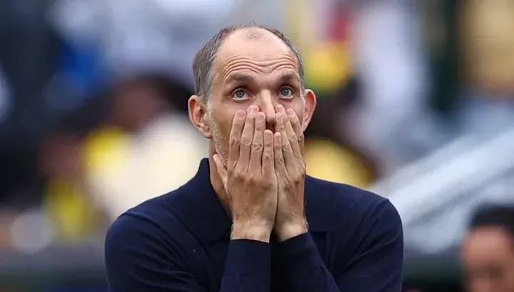 Coach with hands on face during match Coach with hands on face during match