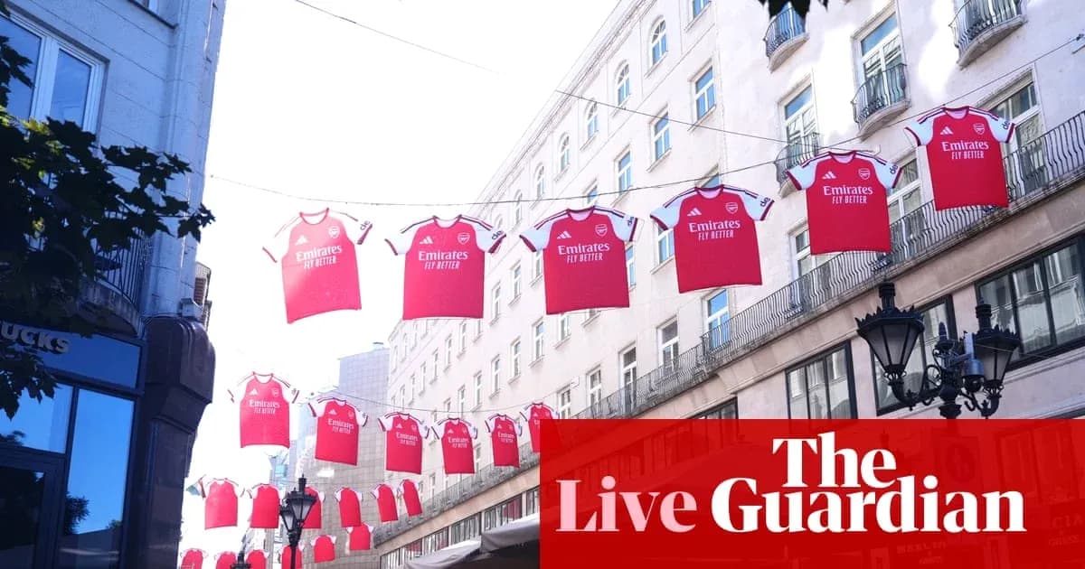 Arsenal jerseys hanging between buildings in city street Arsenal jerseys hanging between buildings in city street