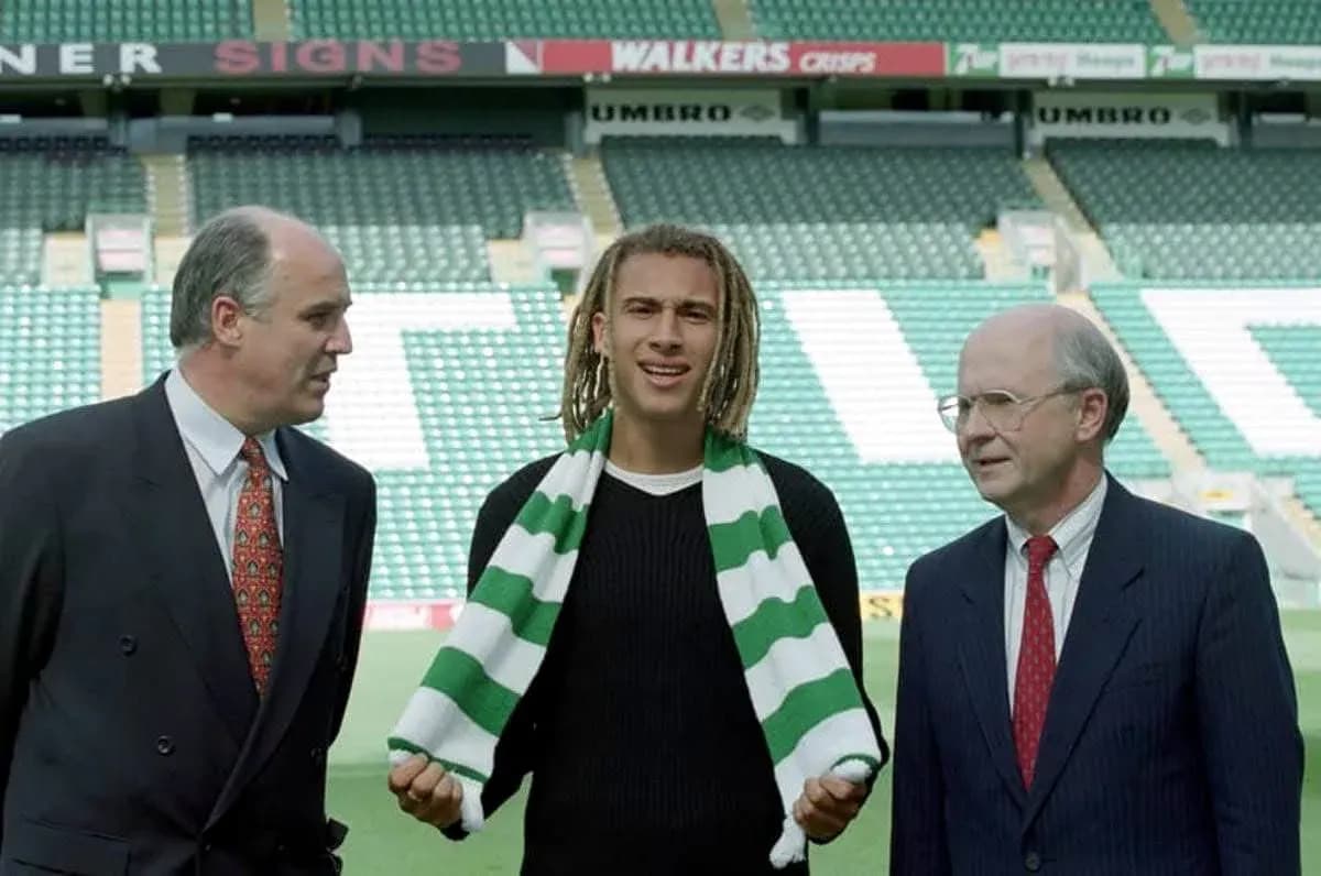 New player holding scarf during signing announcement New player holding scarf during signing announcement