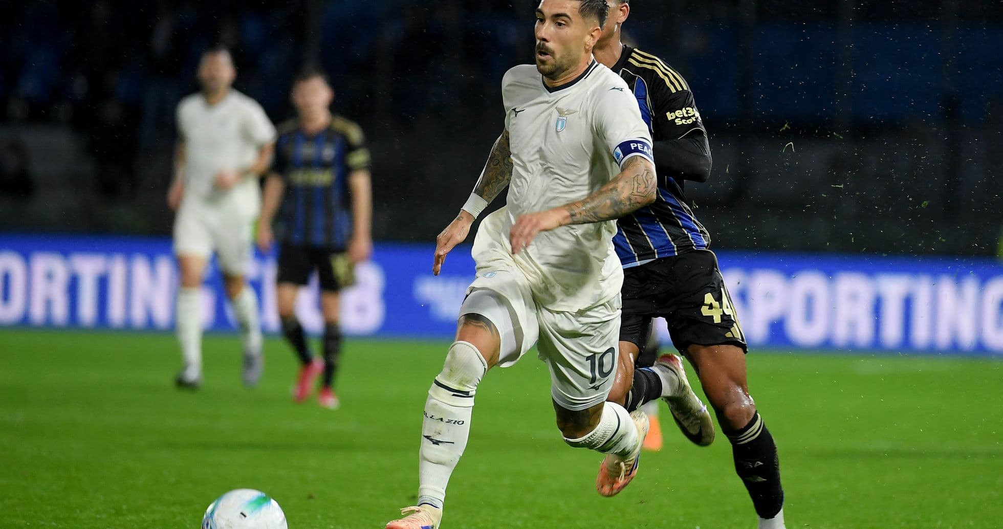 Lazio player running with the ball against Pisa Lazio player running with the ball against Pisa