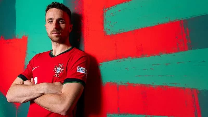 Player in Portugal jersey against colorful background Player in Portugal jersey against colorful background