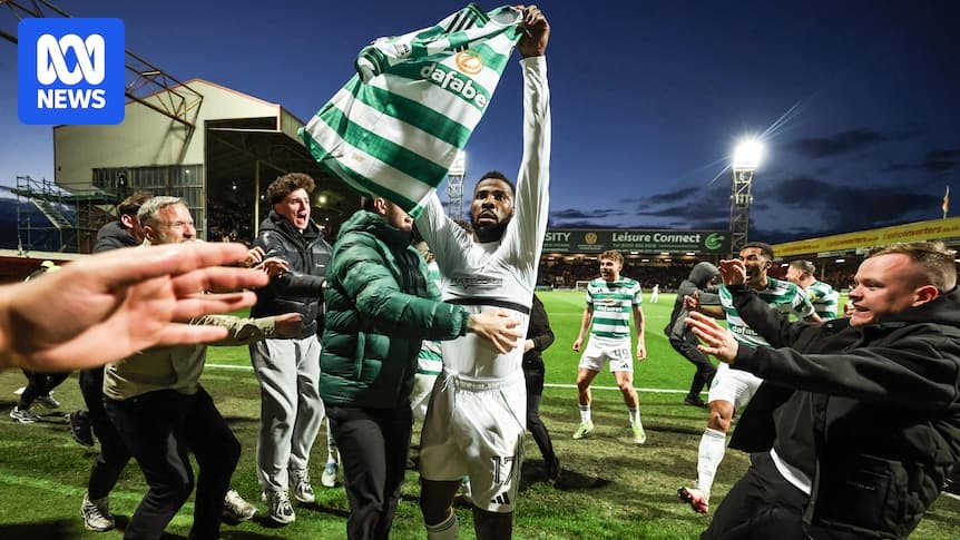 Player celebrating with fans after scoring a goal Player celebrating with fans after scoring a goal