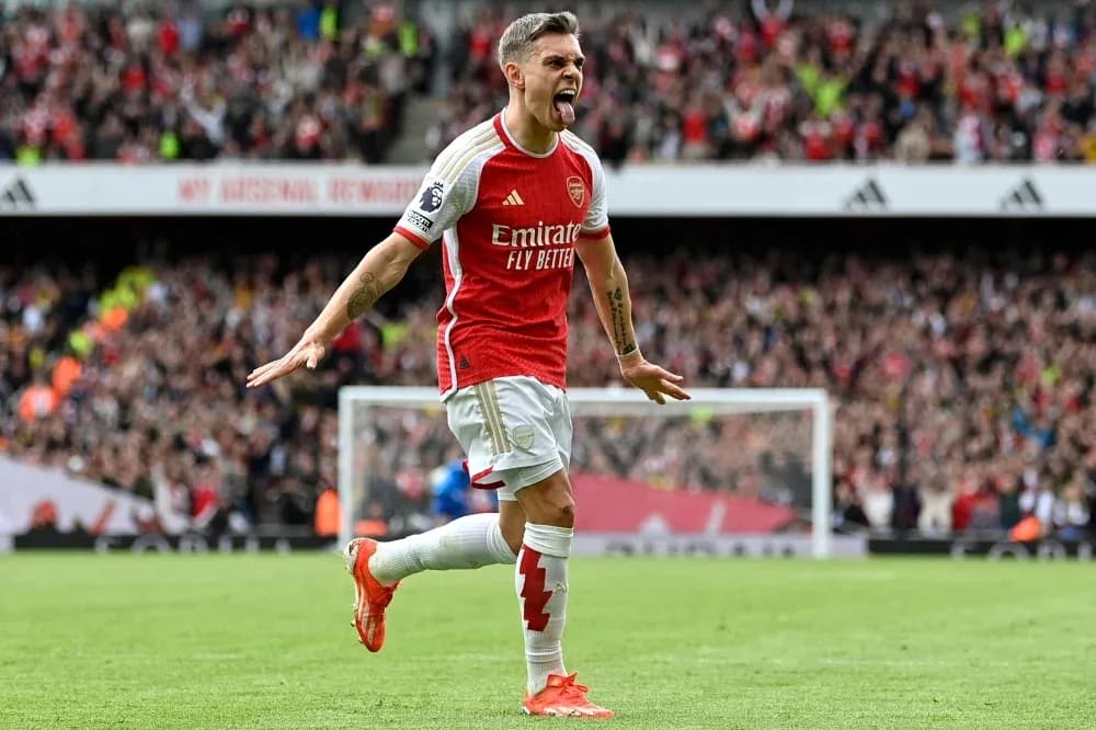 Player celebrating a goal for Arsenal at stadium Player celebrating a goal for Arsenal at stadium